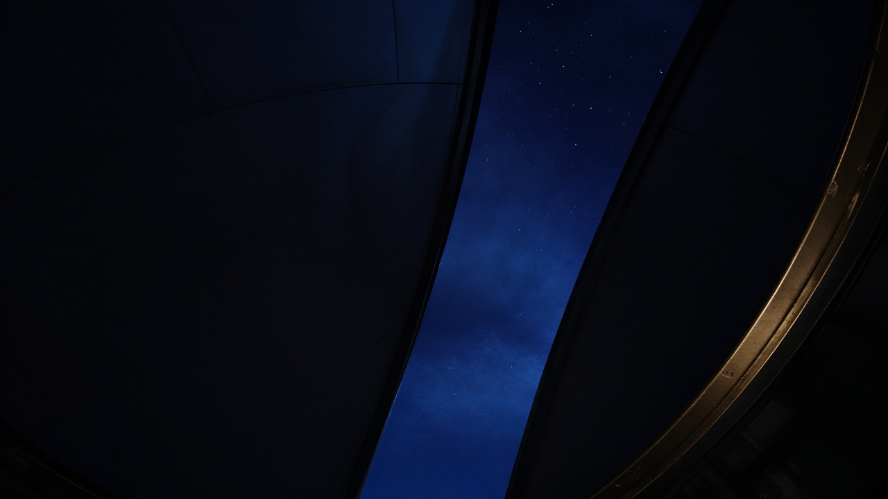 Night sky through an observatory dome slit